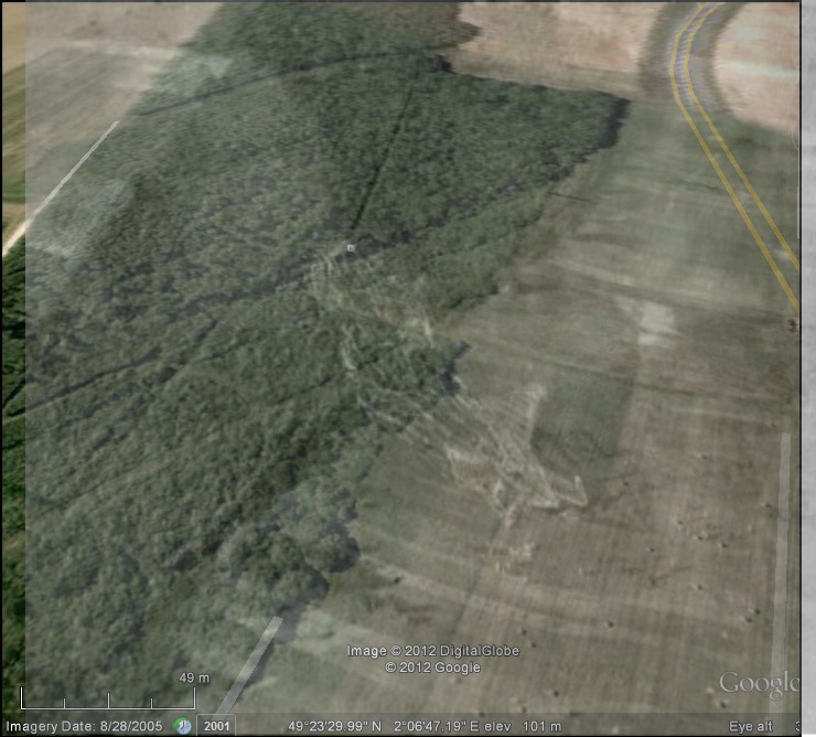A composite image, consisting of a modern shot of the R101 airship crash site with an overlay of the wreckage of the ship from an origional photo of the wreckage, the today image was taken from google earth.